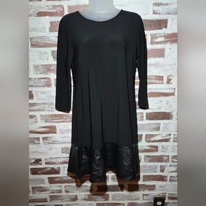 Elegant Black Dress with Faux Leather Hem
